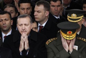 Turkey's Prime Minister Tayyip Erdogan (L) and Chief of Staff General Ilker Basbug pray during a funeral in Ankara in this February 28, 2010 file photo. REUTERS/Umit Bektas/Files